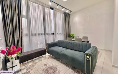 a living room with a couch and a large window at The Heart in Kuala Lumpur City - Majestic Residences in Kuala Lumpur