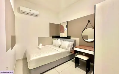 a small bedroom with a bed and a desk at The Heart in Kuala Lumpur City - Majestic Residences in Kuala Lumpur