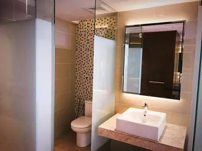 a bathroom with a sink and a toilet at Super Tang Jaya in Kuala Lumpur