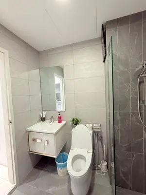 a bathroom with a toilet and a sink and a shower at Majestic Suites KLCC By Fortune in Kuala Lumpur
