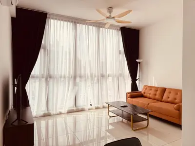 a living room with a couch and a ceiling fan at Majestic Serviced Suites KLCC in Kuala Lumpur
