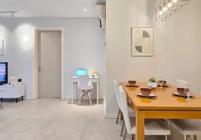 a dining room with a table with chairs and a dining room at Kuala Lumpur Bintang Fairlane #107 TRX Pavilion KL in Kuala Lumpur