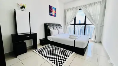 a bedroom with a bed and a mirror and a window at Trion Homestay -KL in Kuala Lumpur