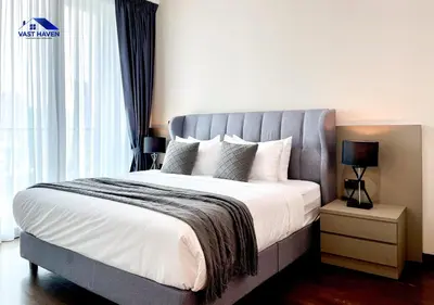 a bedroom with a large bed with a large window at OPUS Residences Kuala Lumpur by VastHaven in Kuala Lumpur