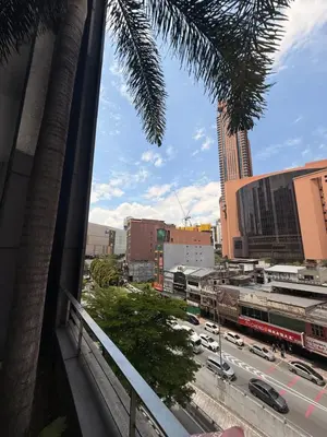 a view from a balcony of a city street with cars at Mykl Family suite Taragon in Kuala Lumpur