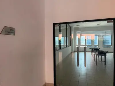 a glass door leading into a room with a table at Mykl Family suite Taragon in Kuala Lumpur