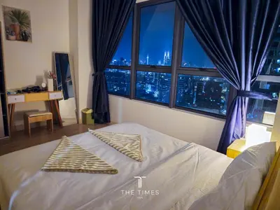 a bedroom with a bed with two pillows on it at Arte Plus Luxury Suites with KLCC View in Kuala Lumpur