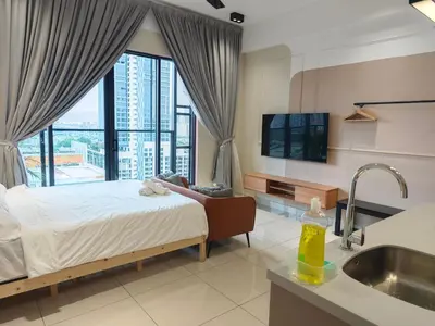a bedroom with a bed and a sink and a window at TRION POOL & KL City View The 110 Family Suite in Kuala Lumpur