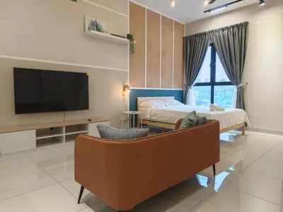 a bedroom with a bed and a tv and a couch at TRION 2BR 6pax Ikea BBCC TRX Velocity KL Base 3KM in Kuala Lumpur