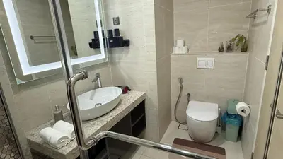 a bathroom with a sink and a toilet at Star Residences KLCC by Nexus 62 in Kuala Lumpur