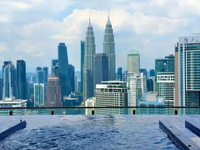 a view of the city from the rooftop of a skyscraper at THE COLONY BY INFINITUM by ZENTRIP in Kuala Lumpur