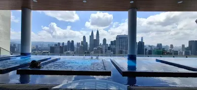a swimming pool with a view of the city at THE COLONY BY INFINITUM by ZENTRIP in Kuala Lumpur