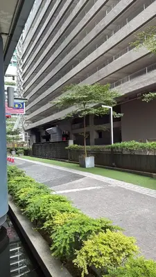 a large building with a tree in front of it at Summer popular suites kl Bukit Bintang in Kuala Lumpur