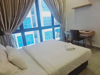 a bedroom with a bed and a large window at Colony Infinitum KualaLumpur by FR in Kuala Lumpur