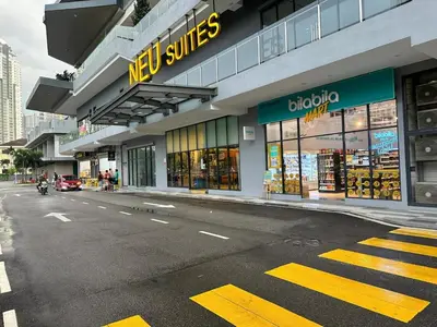 a store on the side of a city street at Neu Suites #2BR Apartment by LammyNora in Kuala Lumpur