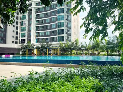 a swimming pool in front of a tall building at Mountain City View 3BR Condo with Swimming Pool & Free WiFi Netflix in Kuala Lumpur