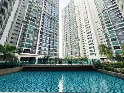 a swimming pool in the middle of two tall buildings at Mountain City View 3BR Condo with Swimming Pool & Free WiFi Netflix in Kuala Lumpur