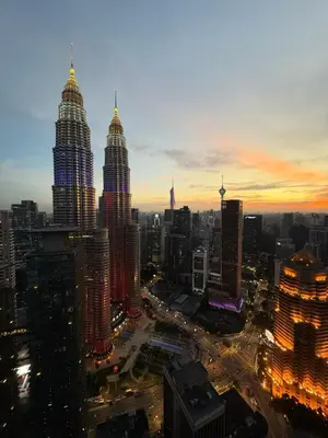 a view of a city skyline at night at KL Star Residences By Nexus Nest 25 in Kuala Lumpur