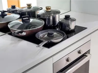 a group of pots and pans on a stove in a kitchen at Vortex suites Klcc by stuning vibes in Kuala Lumpur