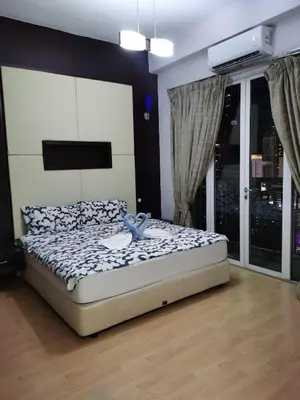 a bedroom with a bed in a room at Seri Bukit Ceylon Bukit Bintang in Kuala Lumpur