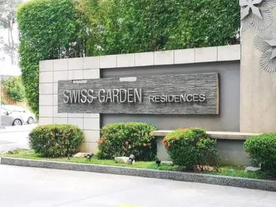a sign for a swiss gardenresbestosbestos at Putra Suite KL in Kuala Lumpur