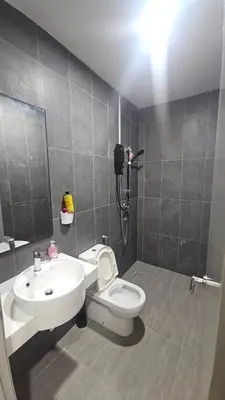 a bathroom with a white toilet and a sink at Astoria Ampang City Centre in Kuala Lumpur