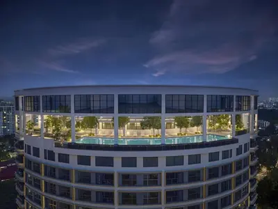 a building with a pool in the middle of it at Warm & Cozy 2Bedroom Apartment at The Atrium Ampang by OKBnB in Kuala Lumpur