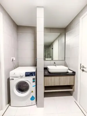 a bathroom with a washing machine and a sink at Warm & Cozy 2Bedroom Apartment at The Atrium Ampang by OKBnB in Kuala Lumpur