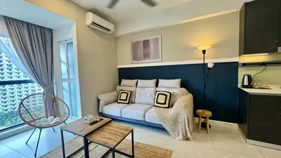 a bedroom with a couch and a table in a room at Warm & Cozy 2Bedroom Apartment at The Atrium Ampang by OKBnB in Kuala Lumpur