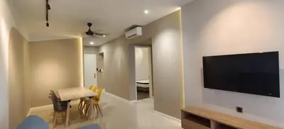 a living room with a flat screen tv on a wall at Arte Mont Kiara by Skyline in Kuala Lumpur