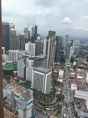 an aerial view of a city with tall buildings at Crown Suits At Times Square in Kuala Lumpur