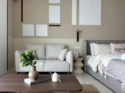a bedroom with a bed and a couch and a table at Elegant Studio - Upscale Neighbourhood of Hartamas in Kuala Lumpur