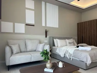 a living room with a bed and a couch at Elegant Studio - Upscale Neighbourhood of Hartamas in Kuala Lumpur