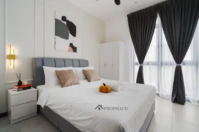 a bedroom with a bed with a pumpkin on it at Neu Suites By Propmach in Kuala Lumpur