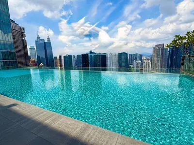 a large swimming pool on top of a city skyline at Crystal Dorsett Infinity Pool KL in Kuala Lumpur