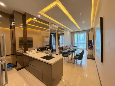 a kitchen and living room with a table and chairs at Crystal Dorsett Infinity Pool KL in Kuala Lumpur