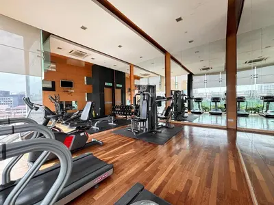 an empty gym with cardio equipment in a building at Casa Residency Bukit Bintang by PILLOWTALKS in Kuala Lumpur