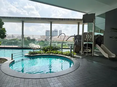 a swimming pool in the middle of a building at Casa Residency Bukit Bintang by PILLOWTALKS in Kuala Lumpur