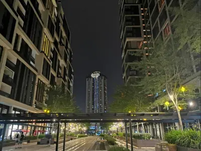 a bridge over a street in a city at night at netflix&chill Arcoris Soho 2R1B Mont Kiara in Kuala Lumpur