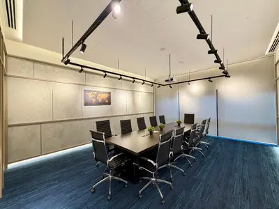 a conference room with a long table and chairs at Agile Bukit Bintang Suits TRX Pavilion By Klcc Sky view 60 floor in Kuala Lumpur