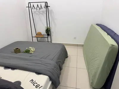a bed in a room with at Trion KL TRX KLCC 6 Pax in Kuala Lumpur