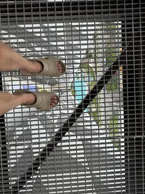 a person is standing on a cage with their feet at Trion KL TRX KLCC 6 Pax in Kuala Lumpur