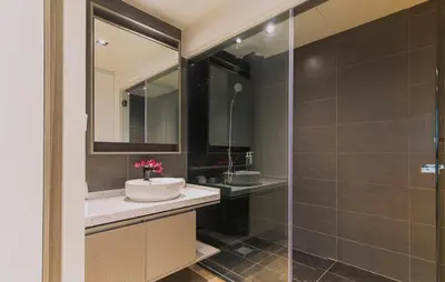 a bathroom with a sink and a shower at Expressions Suite by Rudiman in Kuala Lumpur