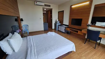 a hotel room with a bed and a television at Expressions Suite by Rudiman in Kuala Lumpur