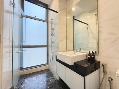 a bathroom with a sink and a glass shower at DD Royce Residence KLCC in Kuala Lumpur