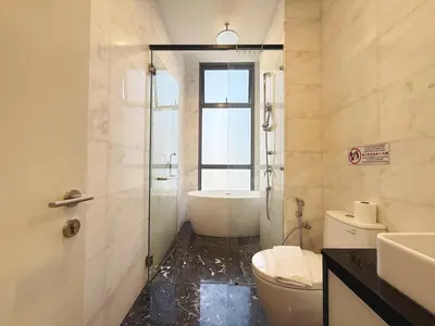 a bathroom with a tub and a toilet and a sink at DD Royce Residence KLCC in Kuala Lumpur