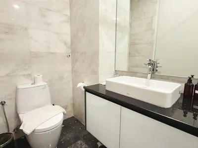 a white bathroom with a sink and a toilet at DD Royce Residence KLCC in Kuala Lumpur