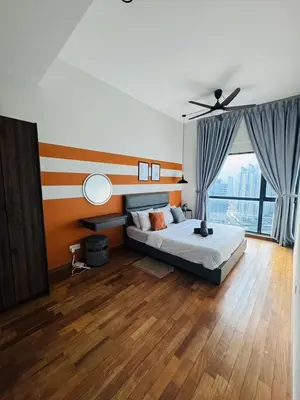 a bedroom with a bed and a ceiling fan at KLCC View Suites By Reizz Residence in Kuala Lumpur