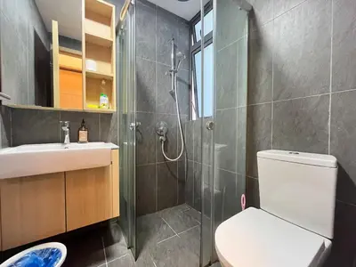 a bathroom with a shower and a toilet and a sink at The Colony By Infinitum R in Kuala Lumpur