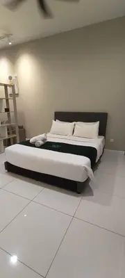 a bedroom with a large bed with white sheets and pillows at Chambers Suites Mrk in Kuala Lumpur